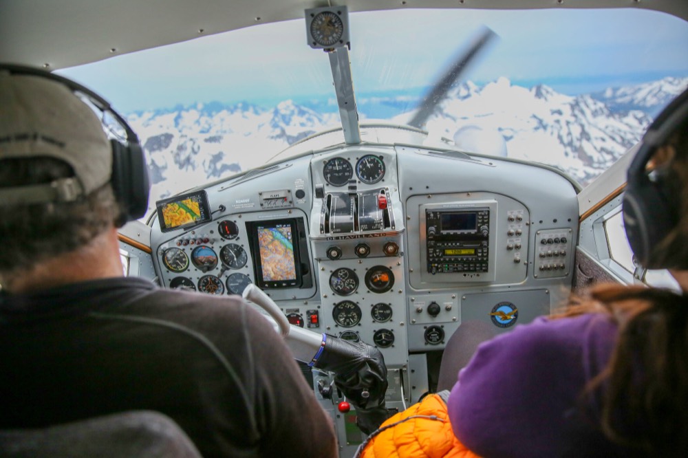 In the cockpit over snow-covered peaks