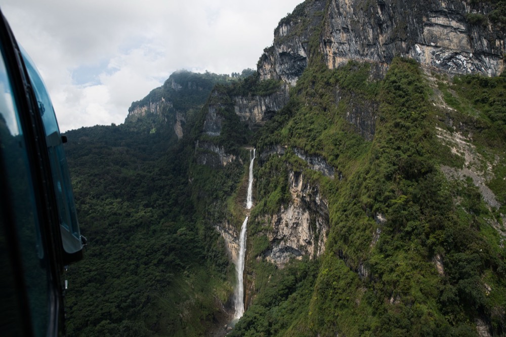 A cloud-forest waterfall from the air, Colombia