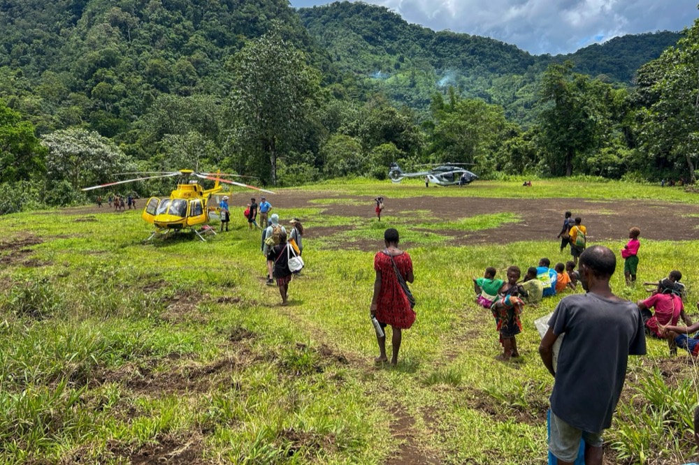Helicopters down on a highland clearing, Papua New Guinea