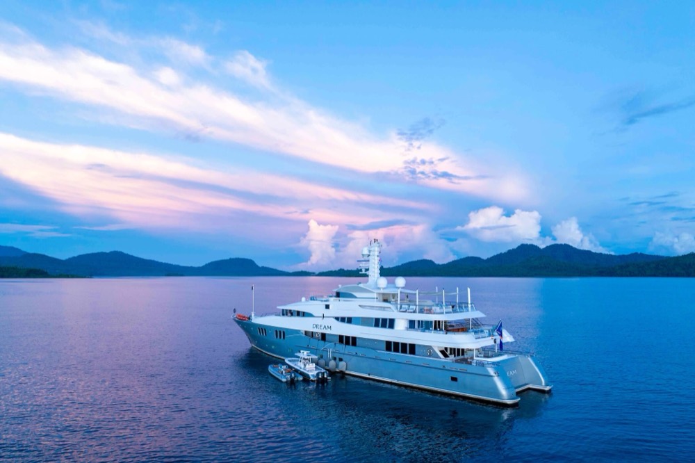 An expedition yacht at anchor at dusk, Papua New Guinea
